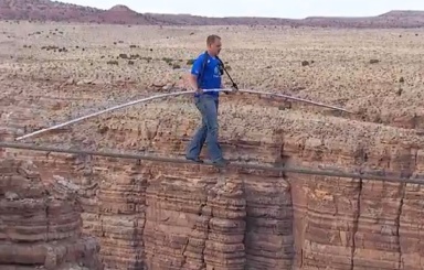 Wire walker Nik Wallenda walks over the Grand Canyon on Discovery Channel's Skywire Live.
